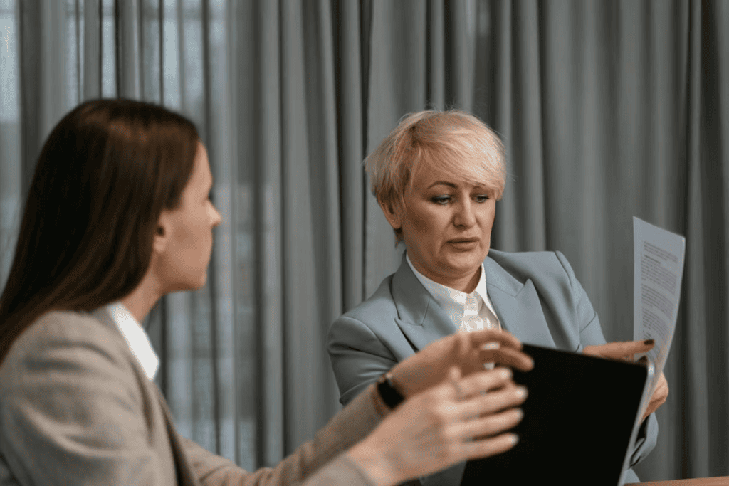 Law firm and staffing agency representatives reviewing partnership progress